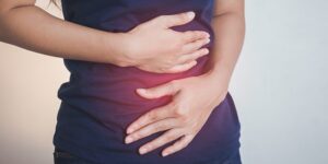 Woman experiencing abdominal bloating